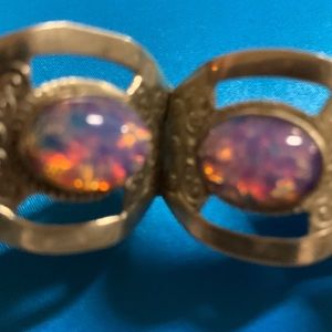 Bracelet has opals in it believe they are real.were sold as real. From Mexico